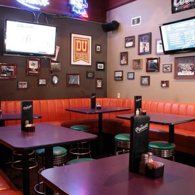 Interior,dining area with TV screens and lots of small pictures on the walls