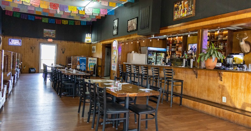 Interior, dining area, tables set for guests