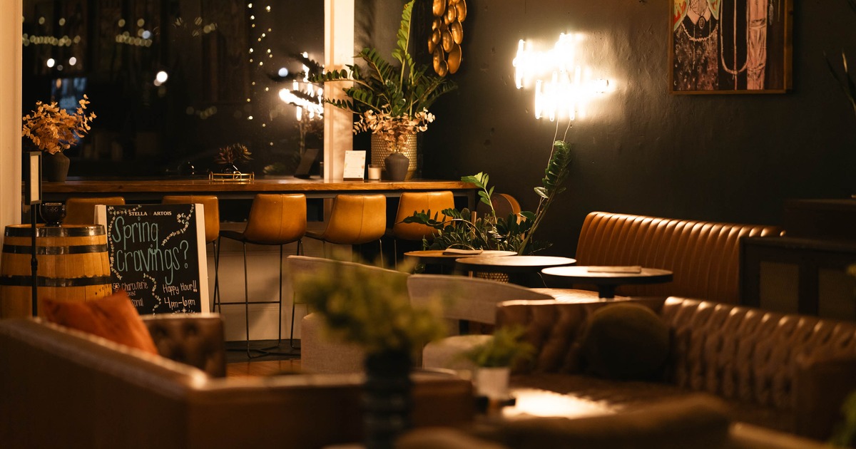 Interior, seating area, sofas and armchairs, high seating in the back by the shop window