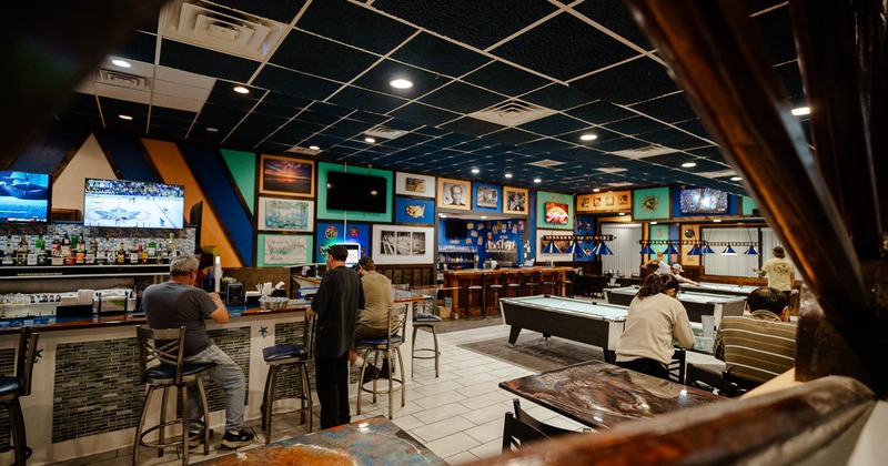 Interior, main dining area with billiards pools in the back