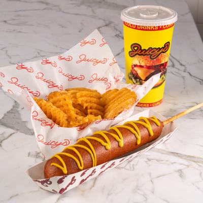 Corndog with side of waffle fries and a drink.