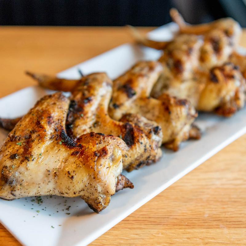 The Oven’s Signature Char - Grilled Wings or Drumsticks photo