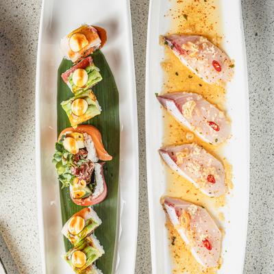Thai Chili Yellowtail plate and Lickity Spill sushi roll plate, overhead view.