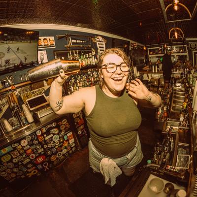 A bartender shaking a drink