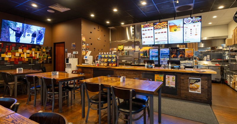 Interior seating area with tables and chairs