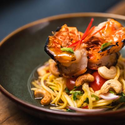 Mango Salad with Grilled Tiger Shrimp, close-up.