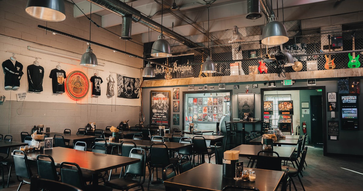 Interior, main seating with, t shirts and guitars on the wall