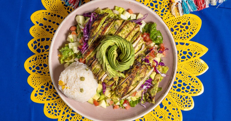 Grilled chicken and avocado salad with rice