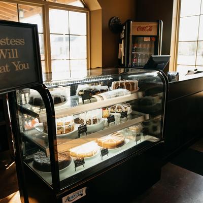 Interior, a counter and a display case with cakes