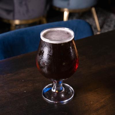 A glass of stout beer.