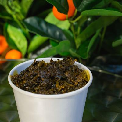 Green dish with spices closeup
