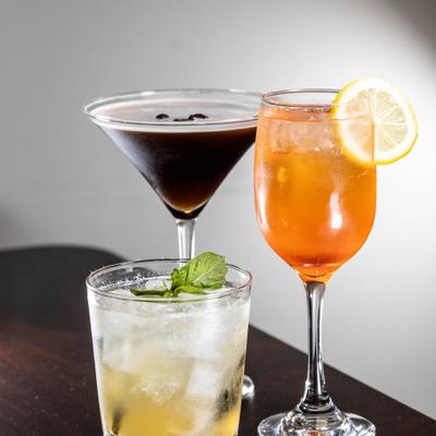 Three different cocktails served on a table.