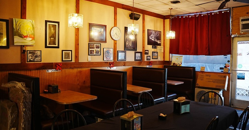 Interior, booth dining area, framed pictures on the wall