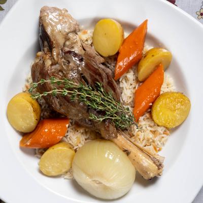 Braised lamb shank, with veggies and rice.