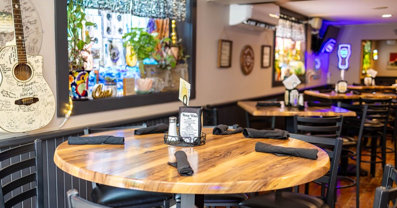 Cozy restaurant interior with a wooden table set for dining