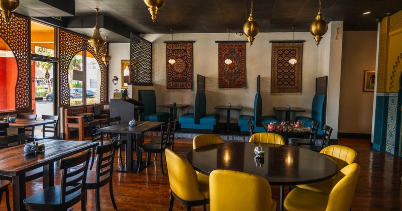 Interior, dining area, seating booths, tables and chairs ready for guests, entrance