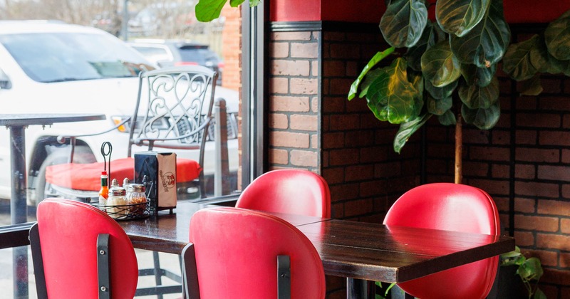 Interior, table and chairs next to the window