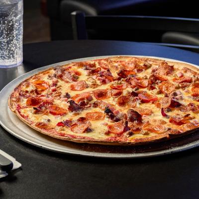 Big Dog Pizza served on a metal tray.