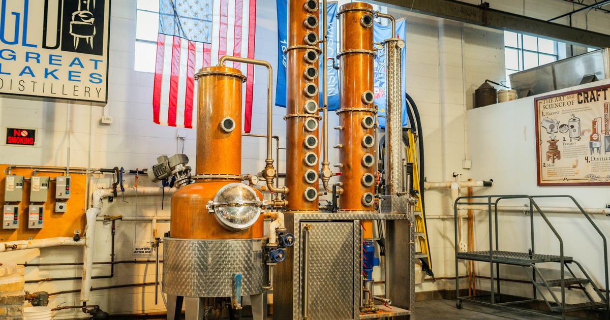 A spacious distillery showcasing a sizable copper still, used for the production of spirits