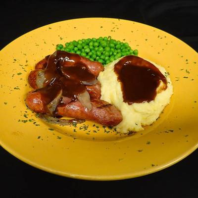 Banger sausages, mashed potatoes and peas