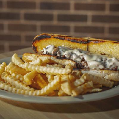 Philly cheesesteak, with mushrooms, and fries