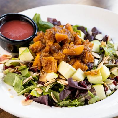 Harvest Salad, with greens, apples, butternut squash, goat cheese, almonds, and cranberries.
