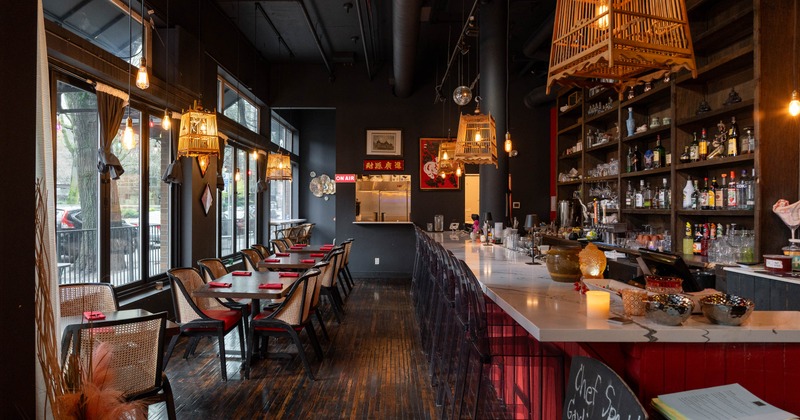 Interior, tables and chairs near bar