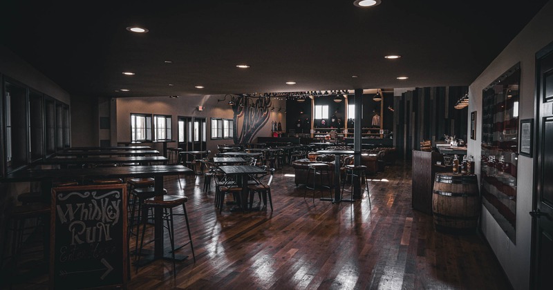 Interior, dining area, high and regular seating tables with chairs, hardwood flooring