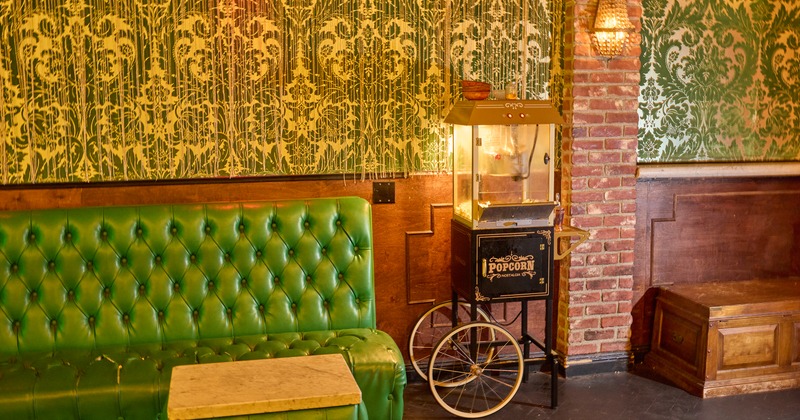 Booths, old popcorn machine between