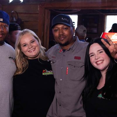 Staffers are posing for a shot.