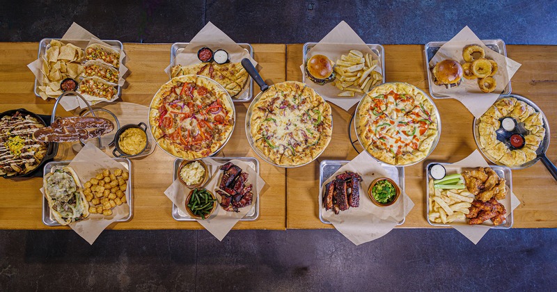 A table with arranged assorted dishes on it, flat lay