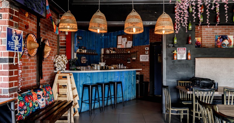 Interior, seating area with a bar in the back