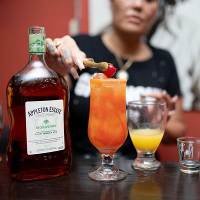 A person preparing drinks.