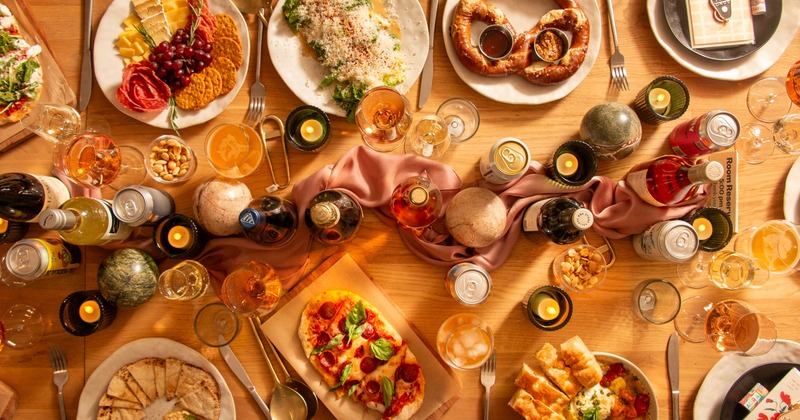 A table filled with diverse dishes and drinks