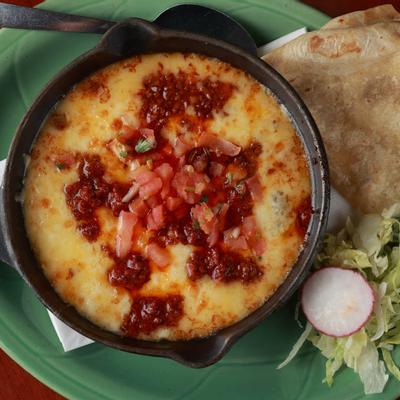 Mexican fondue with cheeses and chorizo, with a side of fresh corn tortillas