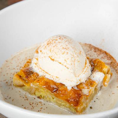 Bread pudding with whiskey butter cream and vanilla ice cream.