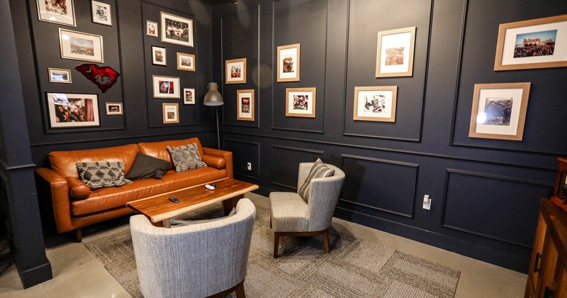Lounge seating area, walls decorated with framed pictures