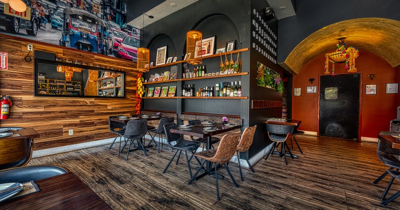 Nicely done interior dining area with set dining tables