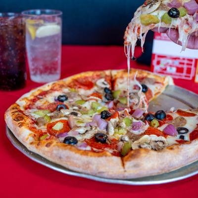 Supreme Pizza, with mozzarella, sausage, pepperoni, olives, peppers, onions, and mushrooms.