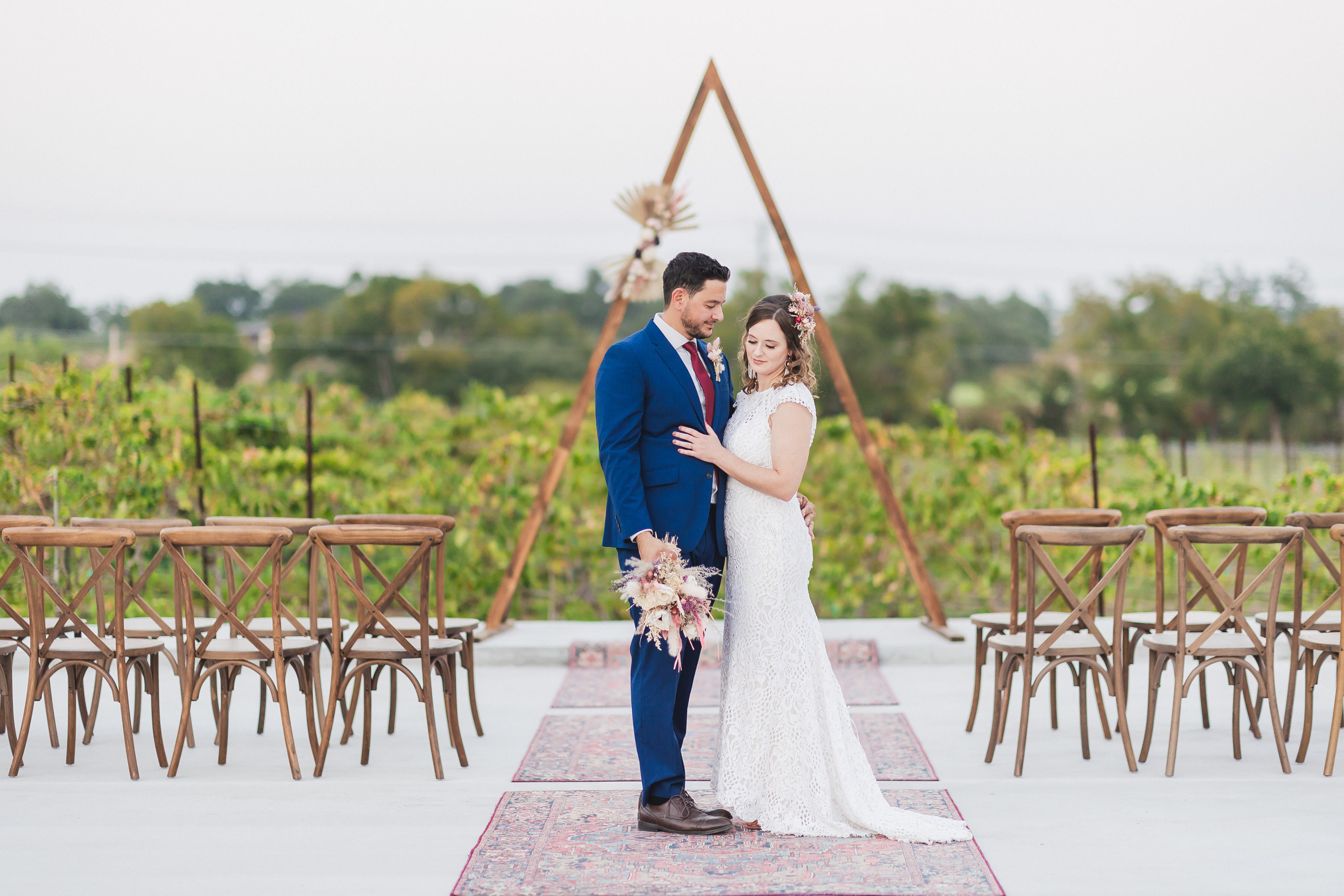 bride and groom at their wedding ceremony in the vineyard