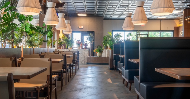Interior, restaurant booths, tables and chairs in seating area