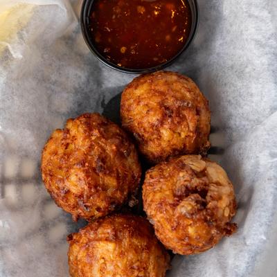 Bacon cheddar balls served with sweet chili dipping sauce.
