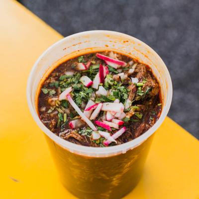 Mexican ramen served in a plastic cup.