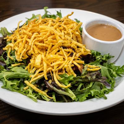 Asian crunch salad with mixed greens, noodles and sesame dressing.