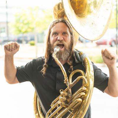 Outside, tuba player.