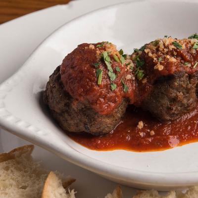 Three meatballs in tomato sauce
