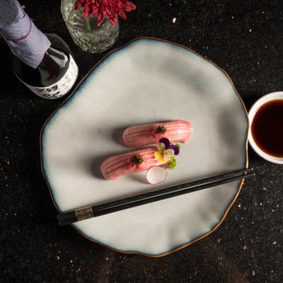 Fatty tuna dish with dipping sauce.