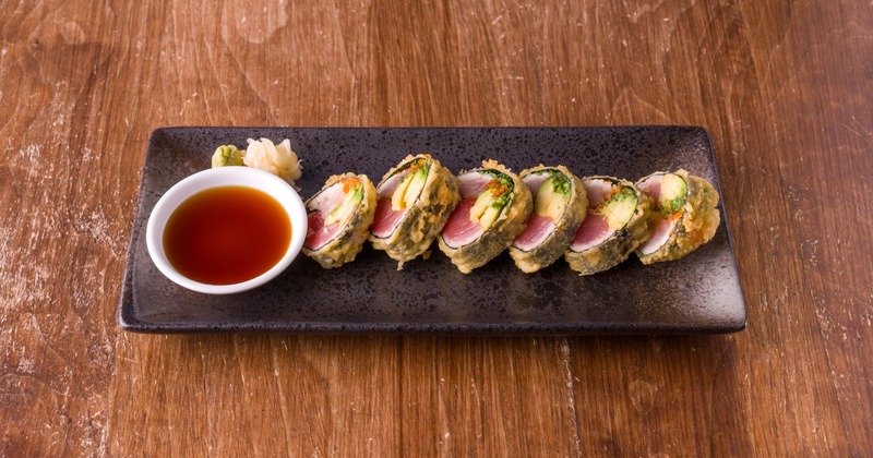 Ecstasy Roll served with a dipping sauce, wasabi and pickled ginger