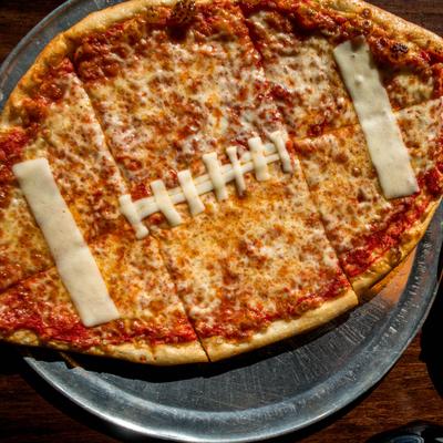 Football-shaped cheese pizza.