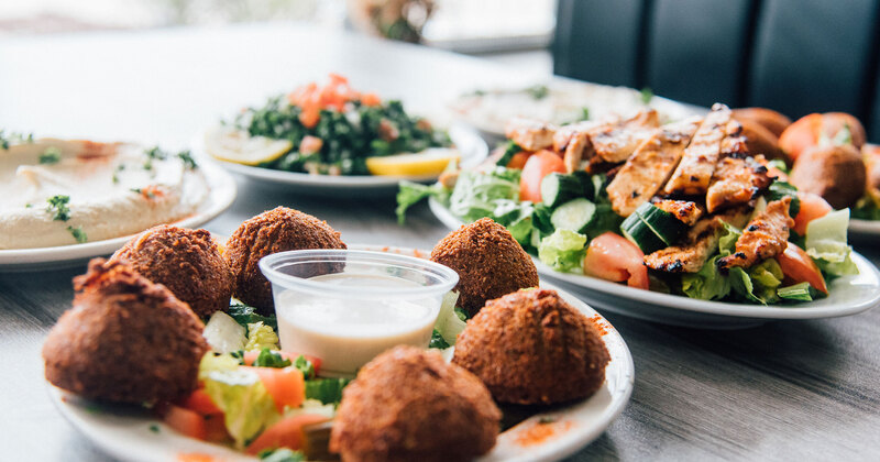 Falafel, salad, white dip in the middle